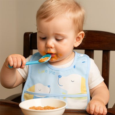 Bavoir bebe | Imperméable avec poche récupératrice - Brico - Bébé.com